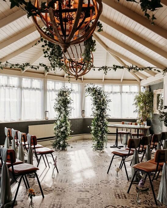 Floral columns and dressed chairs in the Garden Room